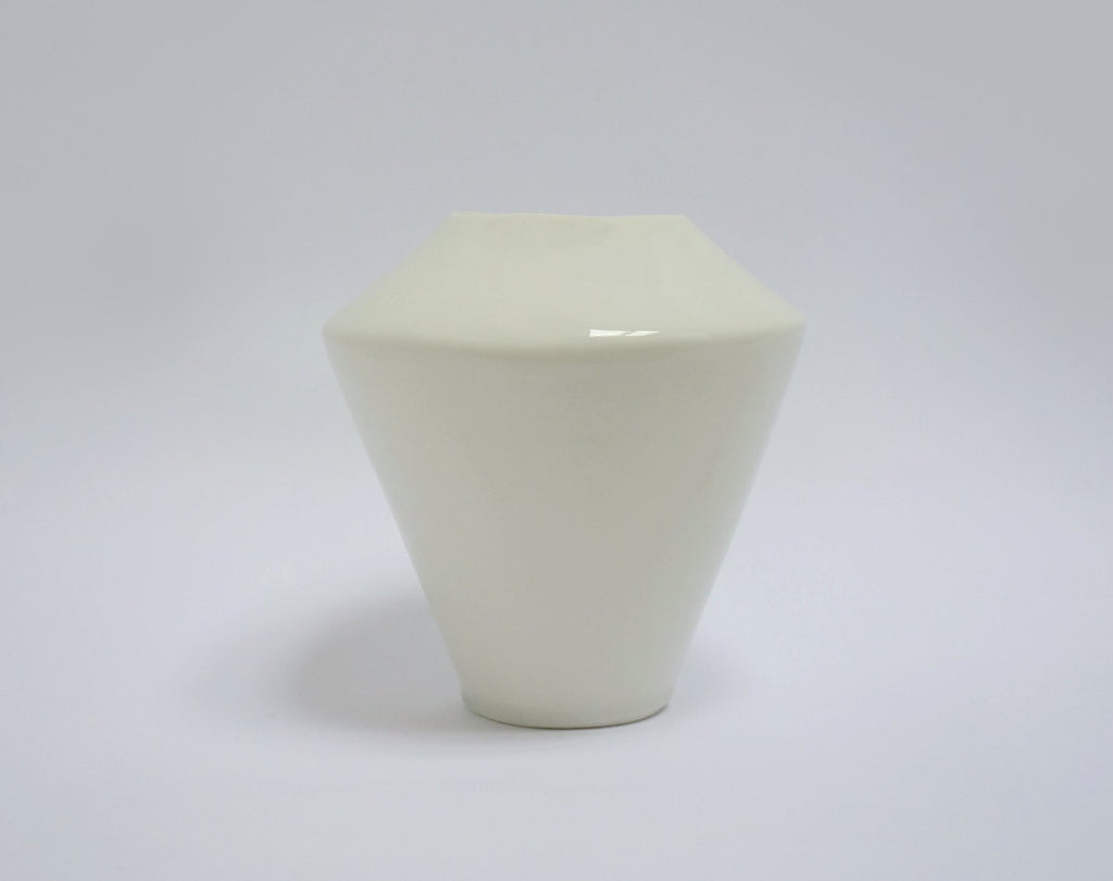 Geometric ceramic vase on a white background