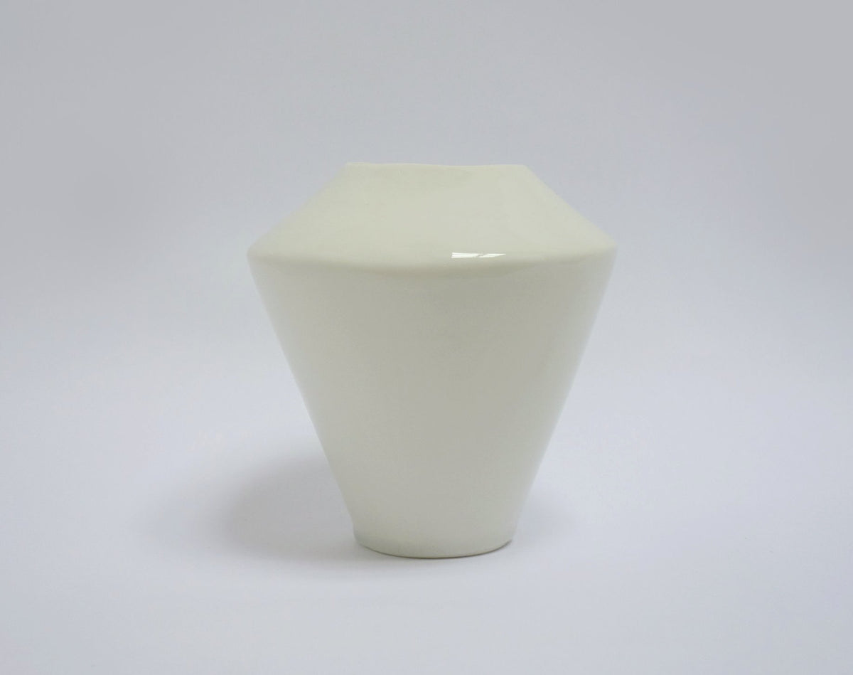 Geometric ceramic vase on a white background