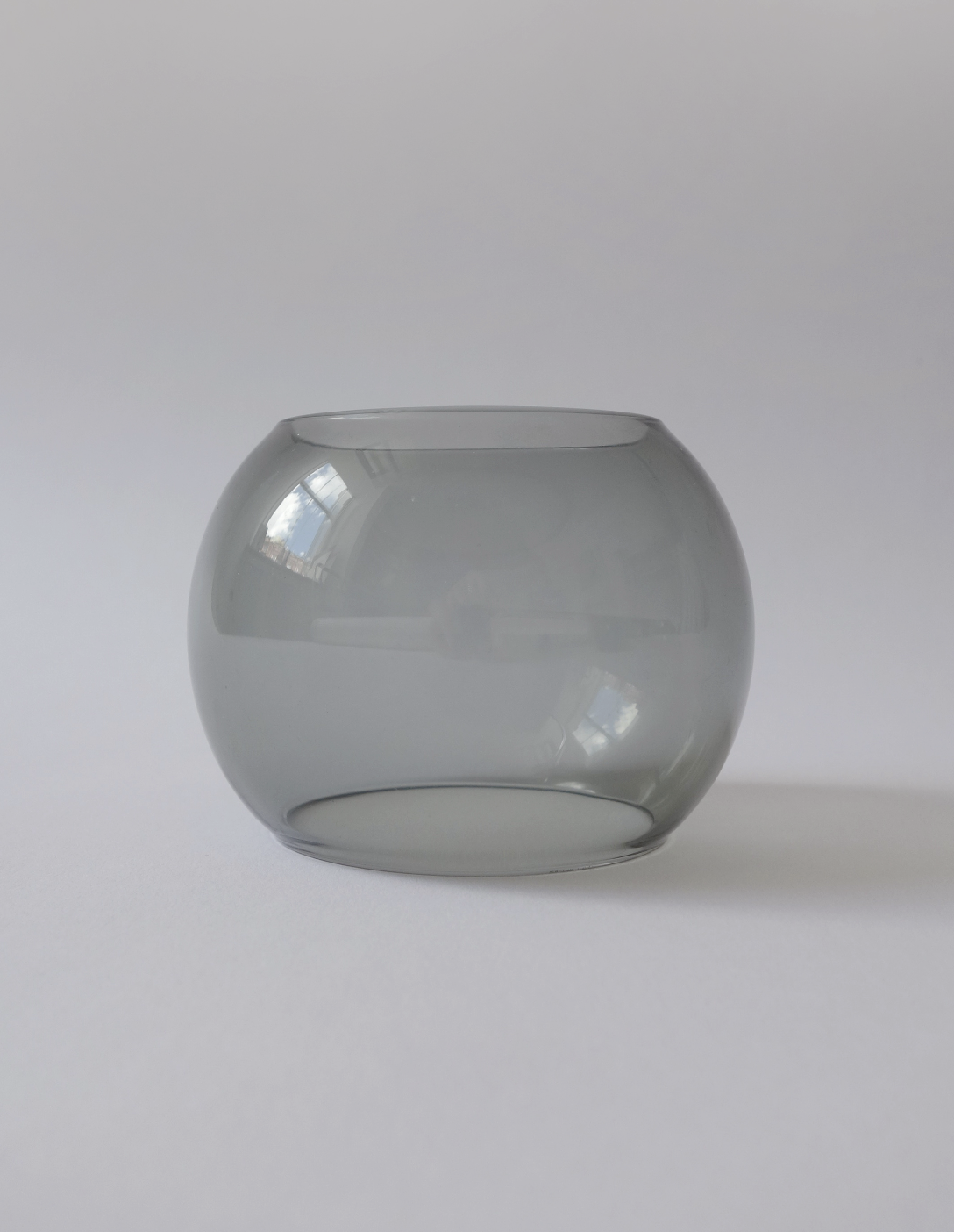 grey glass bangle on a white background