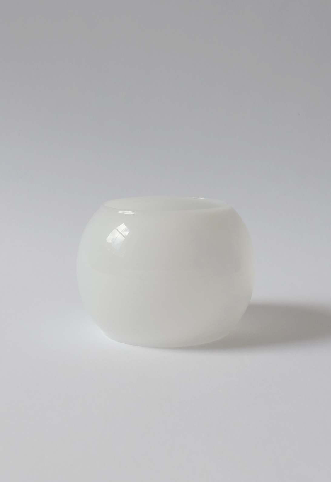 White glass bangle on a white background