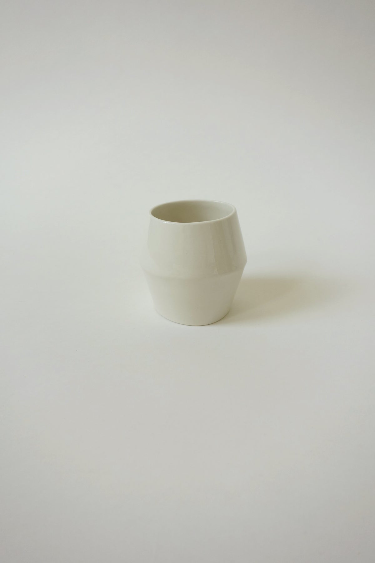 White ceramic bangle on a light gray background